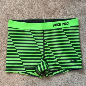 Nike Pro green and gray striped shorts